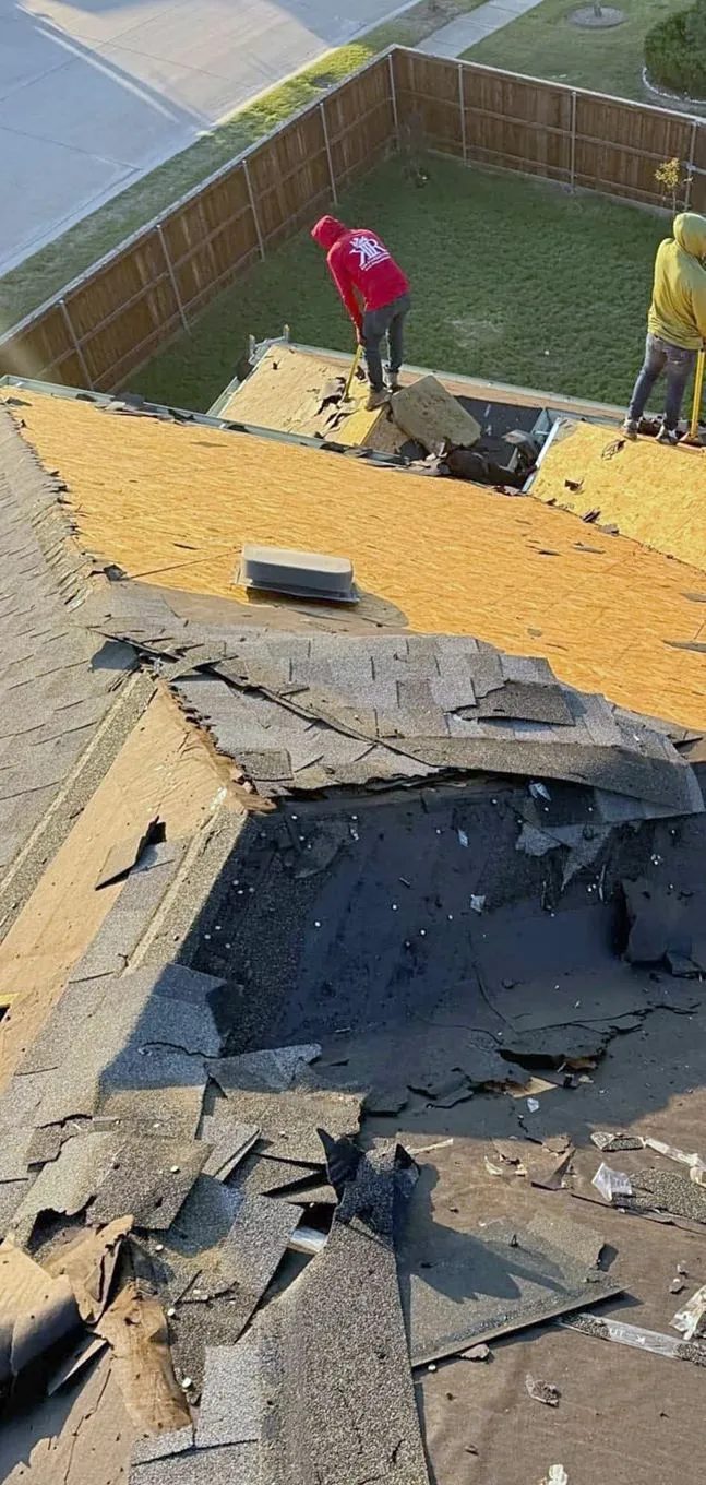 Old shingles torn back to the wood decking during a tear-off